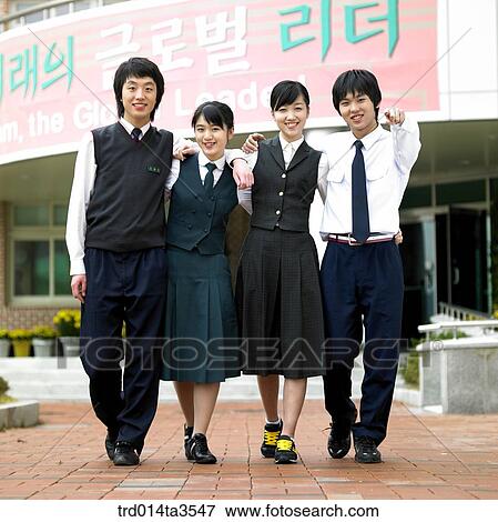 Stock Photo - Students putting arms around each other's shoulder in school. Fotosearch