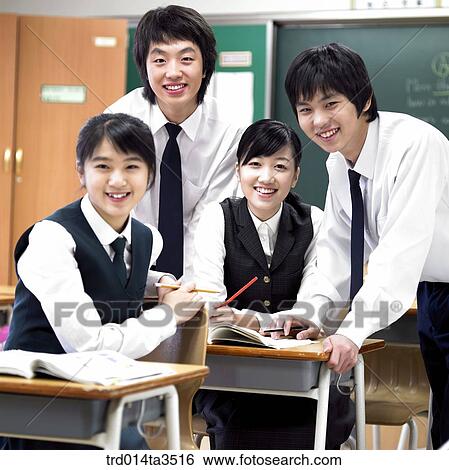 Studnets gathered at friend's desk for solving problem View Large Photo Image Stock Photograph - Studnets gathered at friend's desk for solving problem. Fotosearch