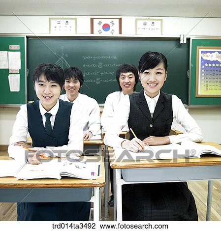 Studnets in uniform rasing hands for question View Large Photo Image Stock Image - Studnets in uniform rasing hands for question. Fotosearch