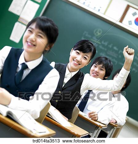 Studnets in uniform rasing hands for question View Large Photo Image Stock Image - Studnets in uniform rasing hands for question. Fotosearch