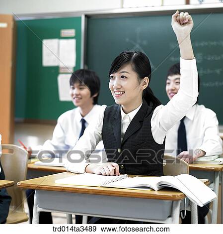 Studnets in uniform rasing hands for question View Large Photo Image Stock Photo - Studnets in uniform rasing hands for question. Fotosearch
