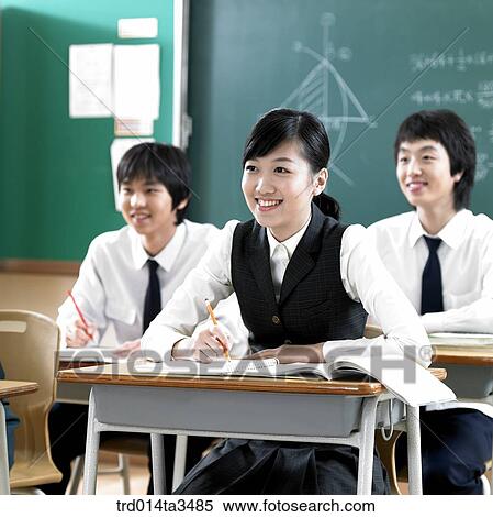 Studnets in uniform taking class in the calssroom View Large Photo Image Stock Photography - Studnets in uniform taking class in the calssroom. Fotosearch