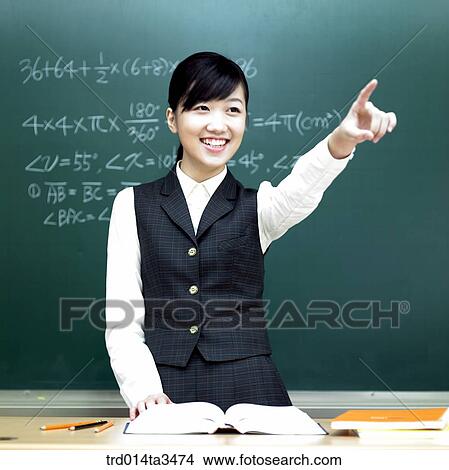 Studnets in uniform taking math class, pointing at front View Large Photo Image Picture - Studnets in uniform taking math class, pointing at front. Fotosearch