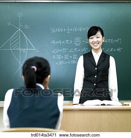 Stock Image - Studnets in uniform taking math class. Fotosearch
