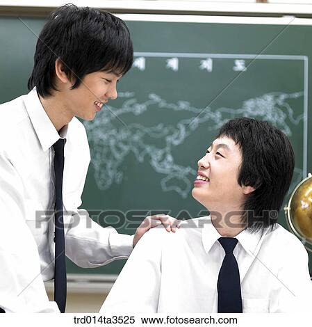 Two students facing each other View Large Photo Image Stock Photography - Two students facing each other. Fotosearch