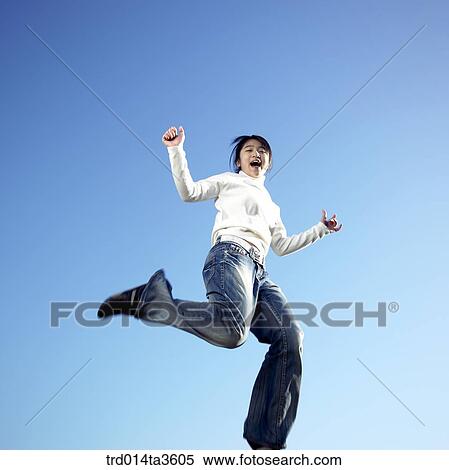 Girl jumping with joy View Large Photo Image Stock Photography - Girl jumping with joy. Fotosearch