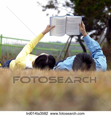 Studying student lying down on the glass View Large Photo Image Stock Image - Studying student lying down on the glass. Fotosearch