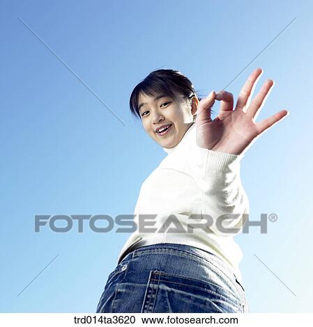 Teen girl with OK sign View Large Photo Image Stock Image - Teen girl with OK sign. Fotosearch