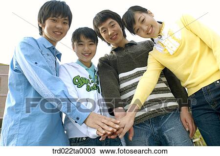 Stock Image - Teens gatherd for cheering up. Fotosearch