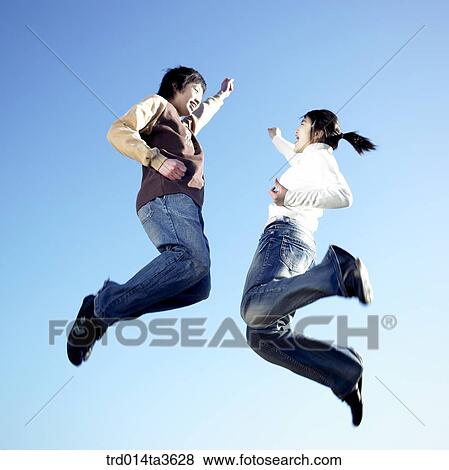 Teens jumping with sheering View Large Photo Image Stock Photo - Teens jumping with sheering. Fotosearch