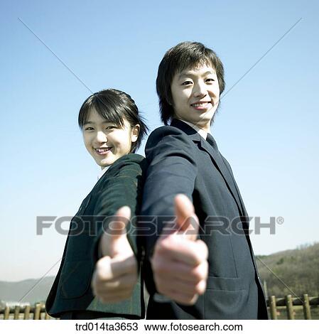 Teens leaning against each other and making thumb up View Large Photo Image Stock Image - Teens leaning against each other and making thumb up. Fotosearch