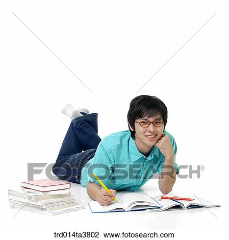 laying down teen boy studying View Large Photo Image Stock Image - laying down teen boy studying. Fotosearch