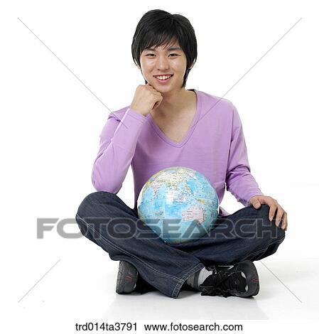 sitting teens holding the globe View Large Photo Image Stock Image - sitting teens holding the globe. Fotosearch