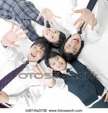 Stock Photo - Students lying down together. Fotosearch