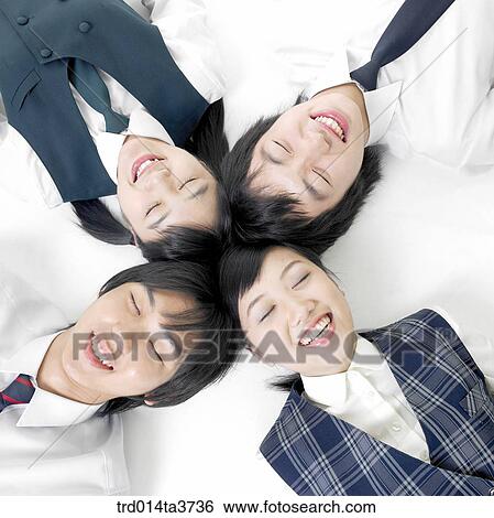 Stock Photograph - Students lying down together. Fotosearch