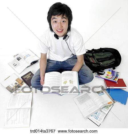 Studying teens in his chair View Large Photo Image Stock Photo - Studying teens in his chair. Fotosearch