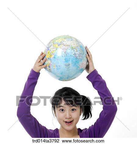 Teen girl hold up the globe View Large Photo Image Stock Image - Teen girl hold up the globe. Fotosearch