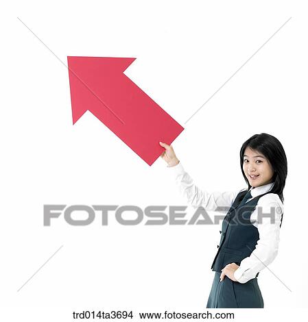 Teen girl in uniform holding red arrow View Large Photo Image Picture - Teen girl in uniform holding red arrow . Fotosearch