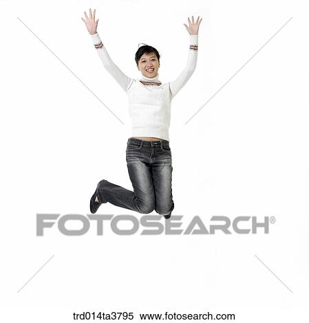 Teen girl jumping with cheering View Large Photo Image Stock Photography - Teen girl jumping with cheering. Fotosearch