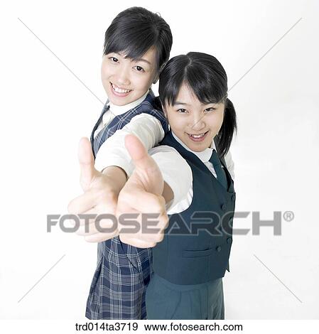 Teen girl standing with thw thumbs up View Large Photo Image Stock Photo - Teen girl standing with thw thumbs up. Fotosearch