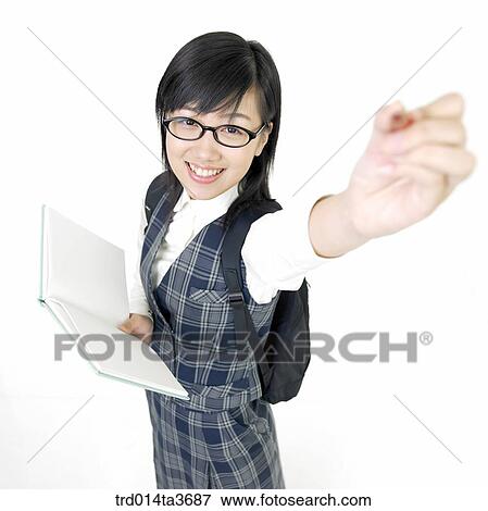 Teen girl with glasses posing for camera with holding pencil View Large Photo Image Stock Photo - Teen girl with glasses posing for camera with holding pencil. Fotosearch
