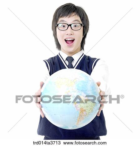 Teen in school uniform holding the globe with surprise View Large Photo Image Stock Image - Teen in school uniform holding the globe with surprise. Fotosearch