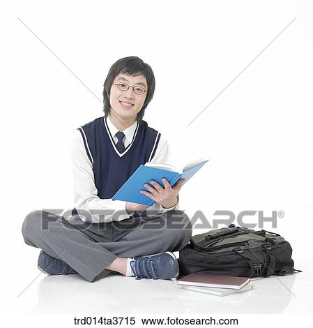Teen in school uniform reading books View Large Photo Image Stock Photography - Teen in school uniform reading books. Fotosearch