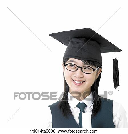 Stock Photo - Teen in school uniform wearing graduation cap. Fotosearch