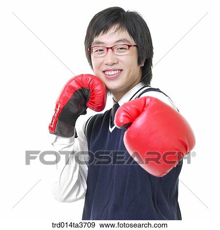 Teen in uniform doing boxing View Large Photo Image Stock Photo - Teen in uniform doing boxing. Fotosearch