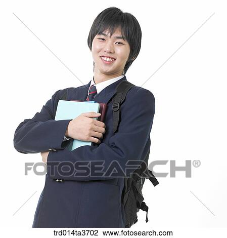 Teen in uniform holding books View Large Photo Image Stock Image - Teen in uniform holding books. Fotosearch