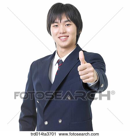Stock Image - Teen in uniform making thumb up. Fotosearch
