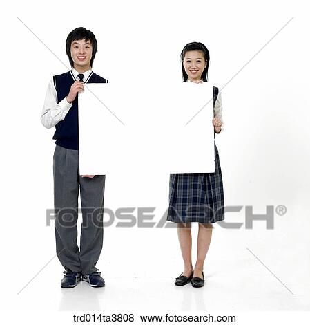 Stock Photo - Teens in school uniform holding paper. Fotosearch