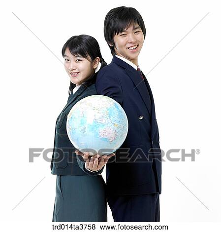 Teens in uniform holding globe View Large Photo Image Stock Photo - Teens in uniform holding globe. Fotosearch