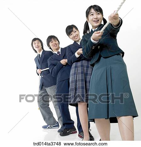 Teens in uniform play at a tug of war View Large Photo Image Stock Photo - Teens in uniform play at a tug of war. Fotosearch