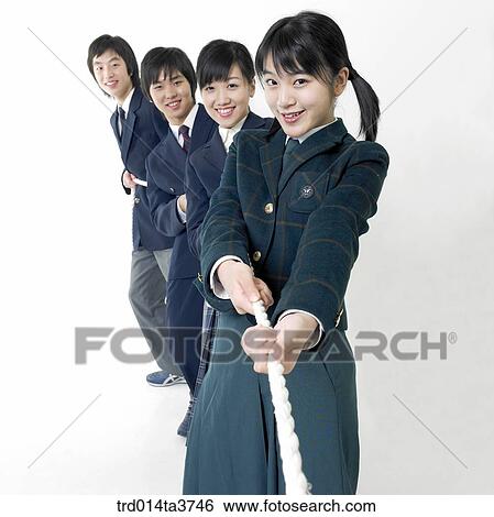 Teens in uniform play at a tug of war View Large Photo Image Stock Photograph - Teens in uniform play at a tug of war. Fotosearch