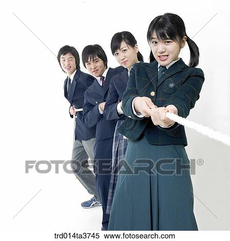 Teens in uniform play at a tug of war View Large Photo Image Stock Photography - Teens in uniform play at a tug of war. Fotosearch
