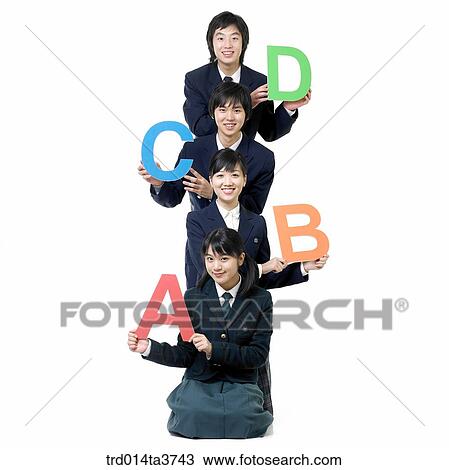 Teens in uniform with Alphabet letters View Large Photo Image Stock Image - Teens in uniform with Alphabet letters. Fotosearch