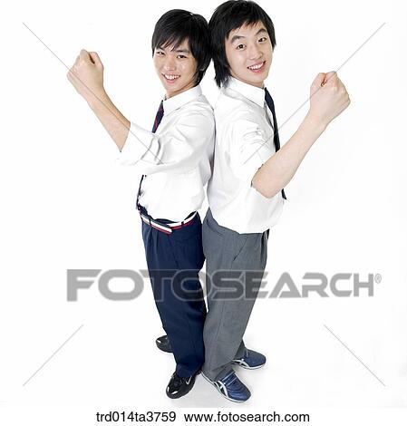 Teens leaning against each other and making fist View Large Photo Image Stock Photo - Teens leaning against each other and making fist. Fotosearch