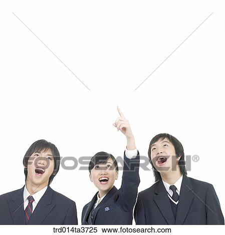 Teens pointing at sky with surprise View Large Photo Image Stock Photography - Teens pointing at sky with surprise. Fotosearch