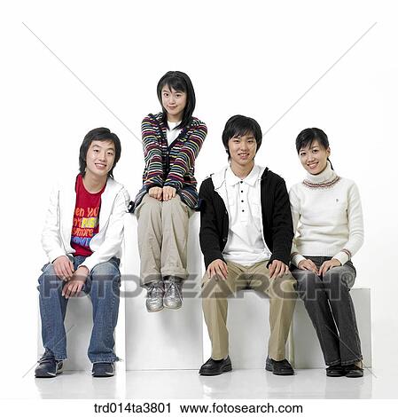 Teens sitting on the block View Large Photo Image Stock Image - Teens sitting on the block. Fotosearch