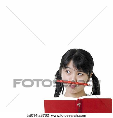 Thinking girl in uniform while reading View Large Photo Image Stock Image - Thinking girl in uniform while reading. Fotosearch