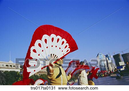 Stock Image - China, Shanghai, Kung Fu practicing people. Fotosearch
