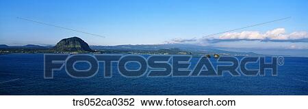 Jeju Island/shoreline in view of sunrise peak View Large Photo Image Stock Image - Jeju Island/shoreline in view of sunrise peak. Fotosearch