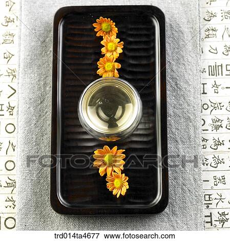 Chrysanthemum on the teatray and glass tea pot, art of tea making View Large Photo Image Stock Photo - Chrysanthemum on the teatray and glass tea pot, art of tea making. Fotosearch
