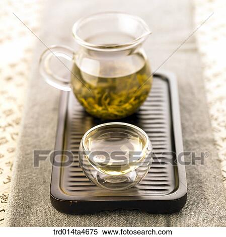 Glass teapot and tea cup on the teatray, art of tea making View Large Photo Image Stock Photography - Glass teapot and tea cup on the teatray, art of tea making. Fotosearch