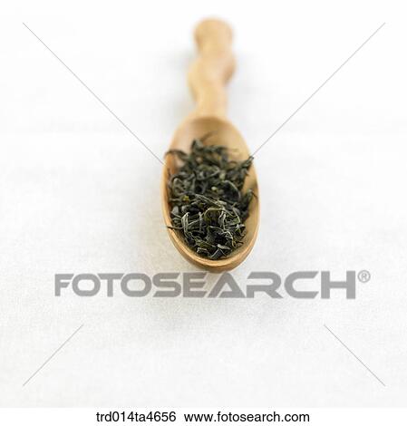 Green tea leaves on the plate, View Large Photo Image Stock Photograph - Green tea leaves on the plate,. Fotosearch