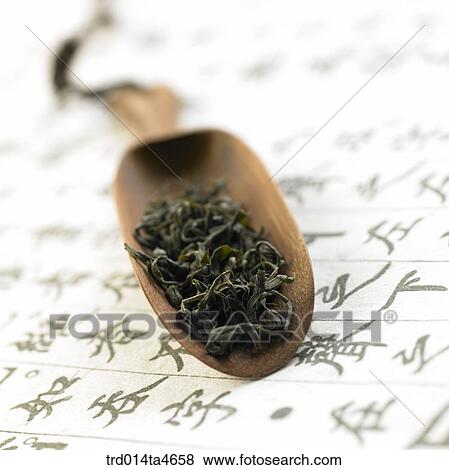 Green tea leaves on the tea spoon, View Large Photo Image Stock Photo - Green tea leaves on the tea spoon, . Fotosearch