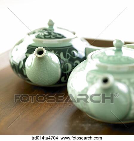Picture - Pattern engraved on the blue teapots. Fotosearch
