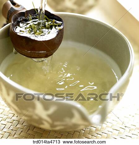 Tea filer with green tea leaves and large bowl View Large Photo Image Stock Image - Tea filer with green tea leaves and large bowl. Fotosearch