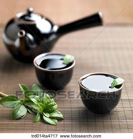 tea leaves flosting on the teacup, art of tea making View Large Photo Image Stock Photo - tea leaves flosting on the teacup, art of tea making. Fotosearch